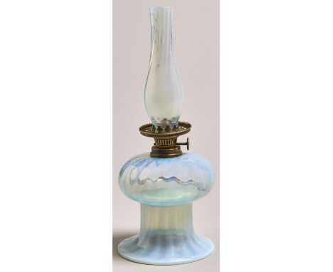 A bell shaped semi opalescent glass oil lamp, c1900, with German brass burner and matching glass chimney-shade, 25cm h  Good 