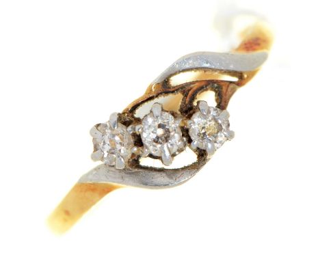 A three stone diamond crossover ring, early 20th c, in gold, 2.1g, size R  Light wear