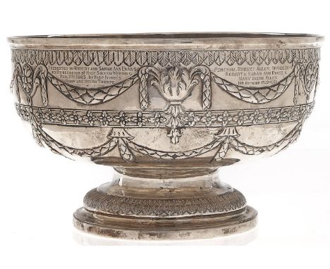 A silver punch bowl, chased with flowers and festoons, engraved Presented to Robert and Sarah Ann Evans on the occasion of th