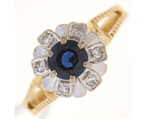 A sapphire and diamond cluster ring in gold with pierced shoulders, marked 18ct, 4g, size M  Good condition