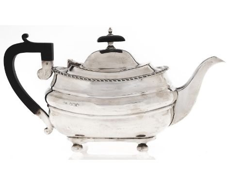 A George V gadrooned oblong silver teapot on bun feet, 15cm h, by Walker &amp; Hall Limited, Sheffield 1930, 25ozs  Light wea