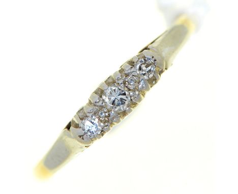 A three stone diamond ring, in gold marked 18ct PLAT, 1.8g, size K  Somewhat worn