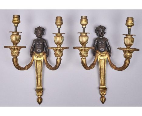 A pair of French bronze and ormolu demi figure wall lights, 20th c, in Louis XVI style, 31.5cm h  Good quality and condition