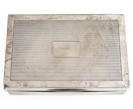 A George V silver cigarette box, engine turned, cedar lined, 14cm l, marks rubbed, by Mappin &amp; Webb Limited, London 1928 