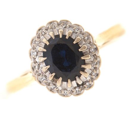 A sapphire and diamond cluster ring, gold hoop marked 18ct plat, 4.1g, size P  Good condition