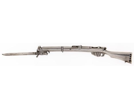 A George V silver model of a Lee Enfield rifle and bayonet, 16.25cm l, by The Goldsmith &amp; Silversmith Co Limited, London,