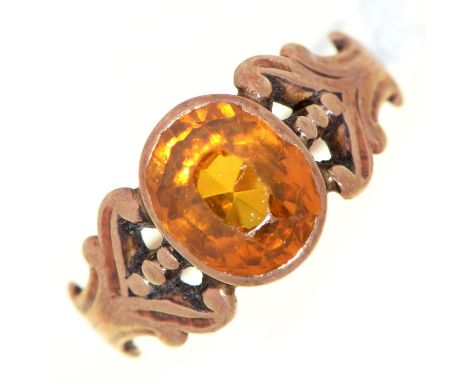 An amber paste ring, early 20th c, in gold, 2.6g, size J  Wear consistent with age