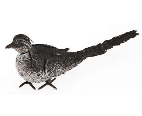 A German silver casting bottle in the form of a pheasant with detachable head with blue paste set eyes, hinged wings, 10cm h,