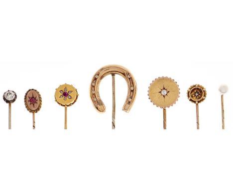 Three Victorian gold stickpins, late 19th c, the terminal of each set with a diamond or ruby and four gold and other stick pi