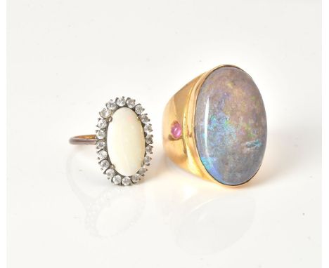 An oval shape opal and white simulant stone cluster ring, opal measures approximately 17.0 x 9.90 x 4.3 mm, mount unmarked, f