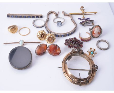 A collection of jewellery including an opal bar brooch; a blue and white sapphire bracelet and panel brooch; a pair of carved