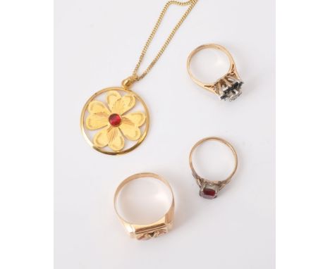 A small collection of gold coloured jewellery, comprising a red paste set glower pendant, on a curb link chain stamped 14k; a