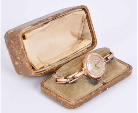 Unsigned,   9 carat gold bracelet watch, circa 1920   Movement: Swiss manual wind   Case: 9 carat gold case, hinged snap case