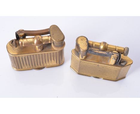 Dunhill, a brass lighter, PAT. No. 143752, with linear decoration, 3.7cm long; and another similar