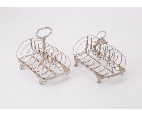 Two similar silver six division toast racks, one George IV by Rebecca Emes &amp; Edward Barnard I, London 1820; the second Wi