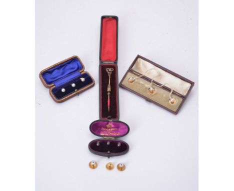 A 19th century gold stickpin, with serpent terminal highlighted with black enamel and red cabochon eyes, cased;  two sets of 