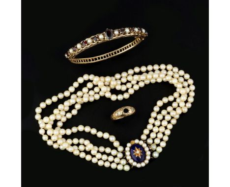 A garnet and cultured pearl bangle, the central oval cut garnet set between alternating circular cut garnets and cultured pea