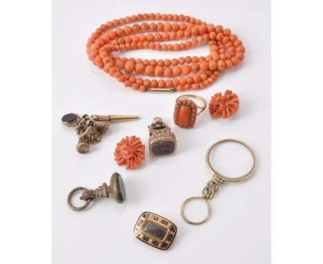 A graduated coral bead necklace, beads graduating from 4.5mm to 8.5 mm; a 19th century coral ring, the rectangular coral plaq