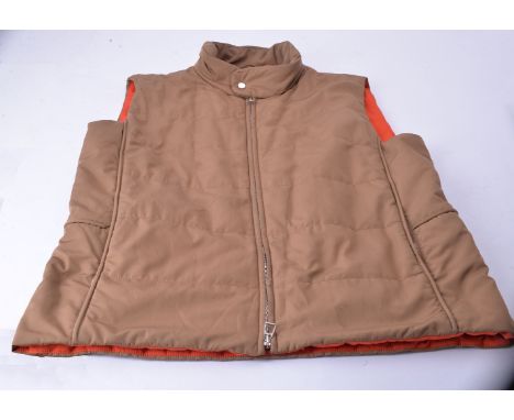 Hermes, a brown gilet body warmer, with two zip pockets and button fastening collar, size XL