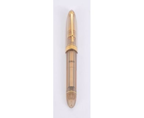 Omas, 360, a clear ball plastic roller ball pen, the cap with a gilt clip and Greek key cap band, with an Omas box, pouch, gu