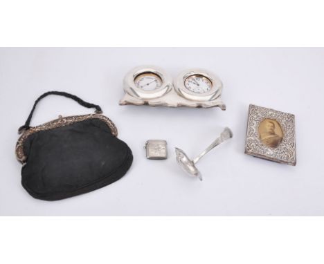 A group of silver, including: an Edwardian silver mounted clock and barometer by John S. Pullinger, Birmingham 1901; a vesta 