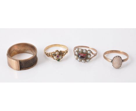A gem set ring, set with a ruby, half pearls and emeralds, finger size N; together with three further rings