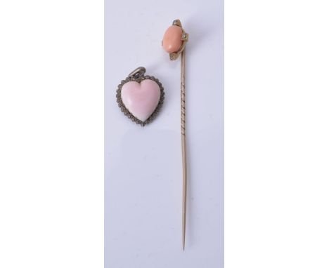 A coral and diamond stick pin, the oval cabochon coral set with old cut diamonds to the cardinal points, 8.2cm long; and a he