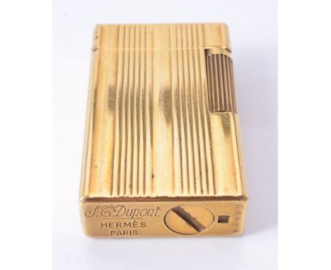 S. T. Dupont for Hermes, a gilt metal lighter, no. C4484, with reeded decoration, 6cm high