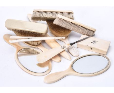 Various dressing table items, early 20th century, mainly ivory, including; two pairs of silver and tortoiseshell mounted brus