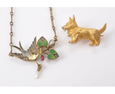 An early 20th century enamel and paste pendant, designed as an enamel swallow amongst enamelled and paste set foliage, suspen