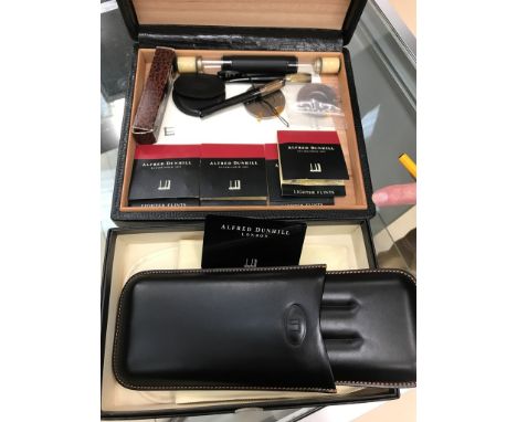 Dunhill smoking ephemera to inc a triple cigar case, a snakeskin wooden lined humidor, cutters and a HM cigarette holder