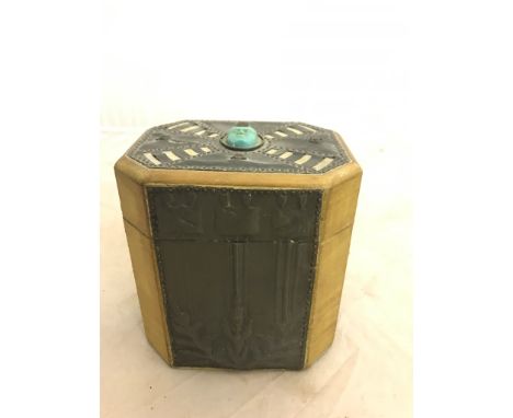 A 19th century fruitwood tea caddy with later Nouveau/Arts & Crafts applied embossed copper panels and cabochons to the top w