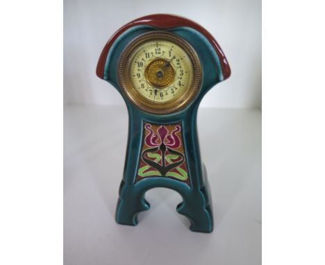 An Art Nouveau ceramic mantle clock - Height 21cm 