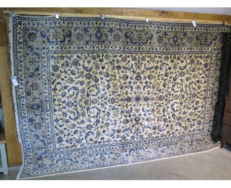 A hand knotted Kashan carpet - 356cm x 247cm - in good condition, recently re fringed 