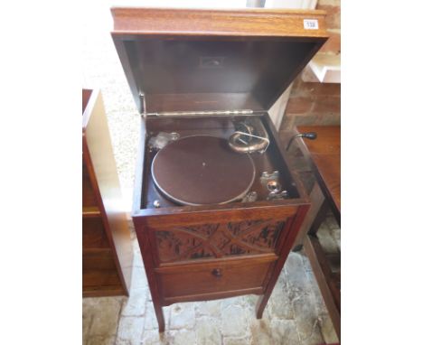 A circa 1920's oak floor standing gramophone with 78's records 