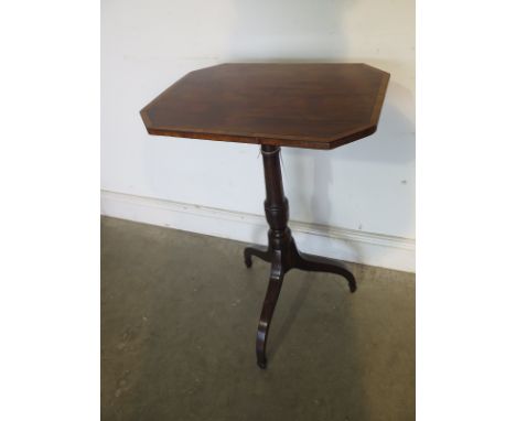 A 19th century mahogany tilt top side table with an octagonal top on a ring turned column and tripod base - Height 75cm x 48c