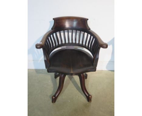 An early 1900's swivel desk office chair 