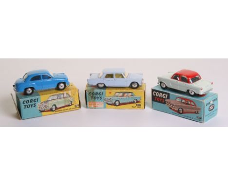 Three Boxed Corgi Toys 202 Morris Oxford, mid blue body, flat spun wheels, in near mint condition, a couple of tiny paint chi