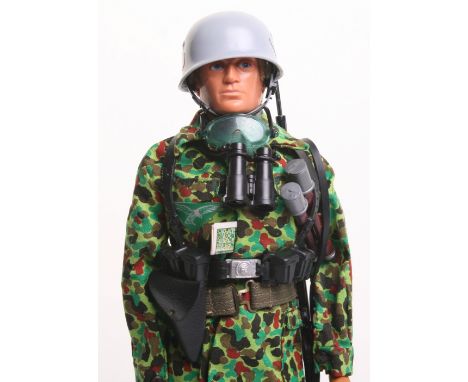 Palitoy vintage Action Man German Luftwaffe Paratrooper, on blond flocked hair, gripping hands, eagle eyed doll, helmet, tuni