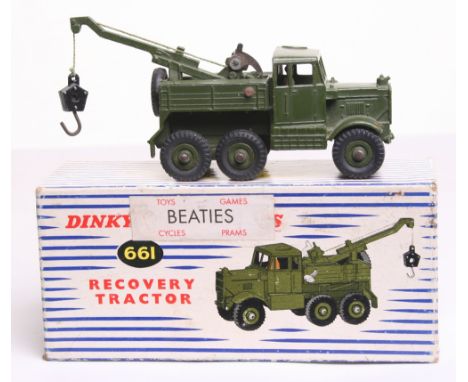 Dinky Toys 661 Recovery Tractor, military green, ridged wheels, driver, in near mint condition, slight rust to one side rivet