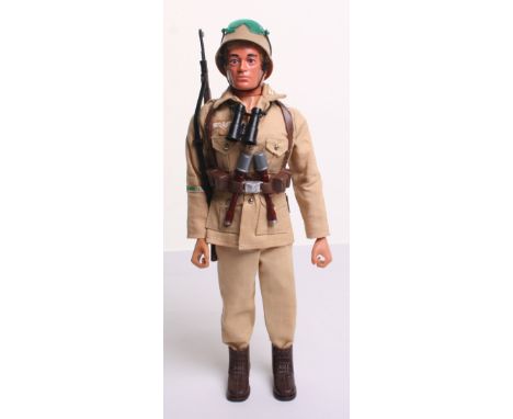 Palitoy vintage Action Man German Afrika Corps, on blond flocked hair, gripping hands, eagle eyed doll, tunic, trousers, helm