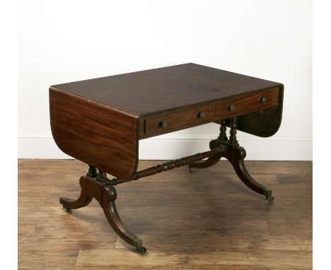 Mahogany and crossbanded sofa table19th Century, with two fitted drawers and two dummy drawers, on shaped supports with brass