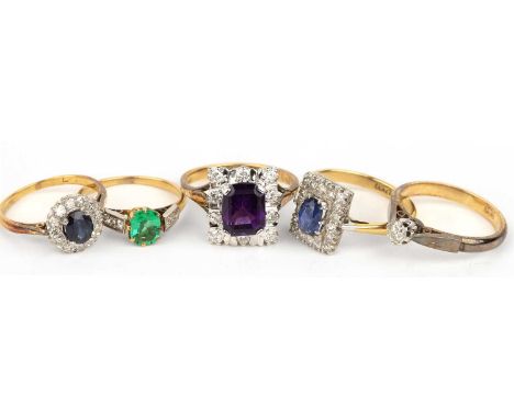 Collection of five rings comprising of: an unmarked precious yellow metal ring set with four small diamonds and a green stone