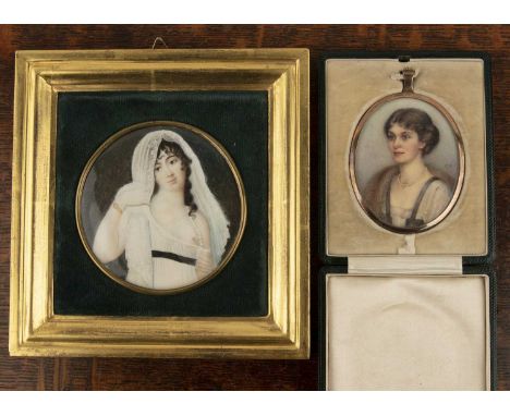 Two miniature portraitsto include an Edwardian study of a lady, monogrammed MD, in an oval gold mount in a fitted leather cas