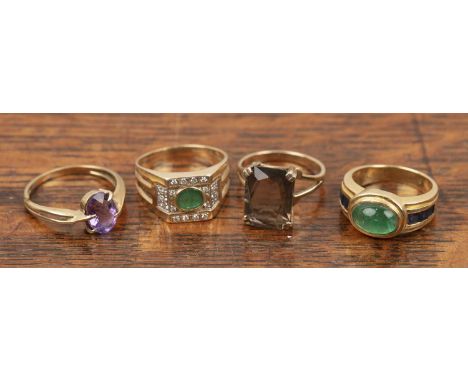 Collection of four rings comprising of: an yellow precious metal ring stamped '750' set with a green cabachon stone, 8g appro