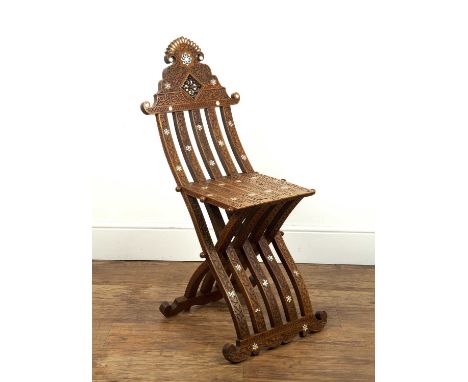 Damascus mother-of-pearl inlaid chairSyrian, with carved inscription, and foliate designs, 37cm wide x 97cm highSome light we