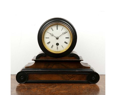 Victorian drum cased mantel clock in walnut case on a shaped plinth with ebonised detail, the white enamel dial with Roman nu