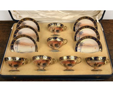 Cased Noritake porcelain tea setcomprising of six cabinet teacups and saucers, decorated with Arabian scenes and gilt painted