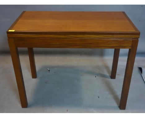 A teak foldover card table, stamped Staverton, raised on square legs, H.71 W.92 D.51cm 