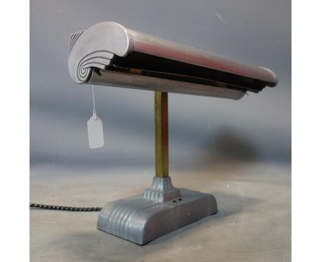 An Art Deco pewter and brass bankers lamp, with label for 'the sight light corporation', H.34 W.47 D.20cm 